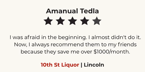 Happy Omaha liquor store owner sharing positive feedback about HuskerPay merchant processing services.